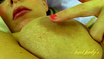 Auntjudys' big natural tits and juicy pussy take center stage in this retro porn video