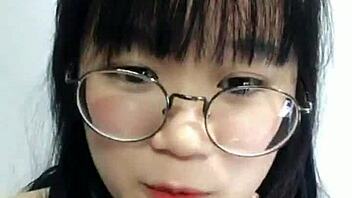 Sexy Korean schoolgirl in a cosplay outfit shows off on webcam