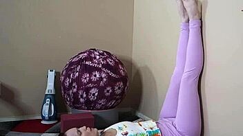 Fitness instructor gives self-care instruction in yoga pants