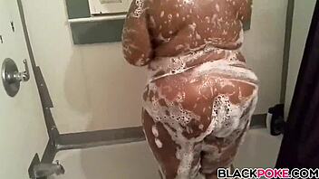 Amateur ebony shemale teases in the shower
