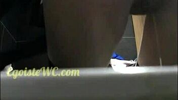 Hidden camera captures young girl's pissing in the toilet