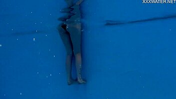 Nordic teen Mimi Cica shows off her juicy ass and natural tits underwater