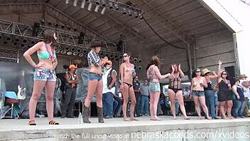 Young and nerdy bikers compete in a wet shirt contest