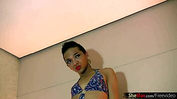 Asian shemale in bikini and heels jerks off and cums on camera