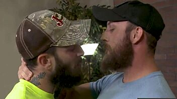 Tattooed gay couple enjoys anal sex and facial hair in HD video