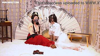 Chinese mistress teases and tickles her submissive with anal toys