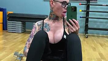 Big tit tattoo girl masturbates in public