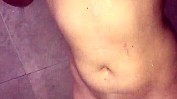 Masturbating in the shower with a big natural tits girl