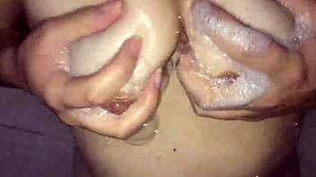Masturbating in the shower with a big natural tits girl
