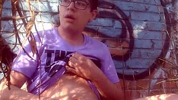 A hot naked boy jerks off outdoors