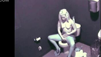 a blonde babe caught fingering herself in public restroom on cam