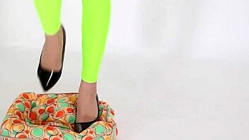 beautiful woman in high heels stepping on cushion