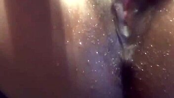 ebony babe in a water play scene with toys