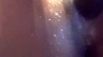 ebony babe in a water play scene with toys