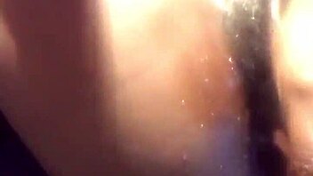 ebony babe in a water play scene with toys