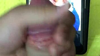 In a homemade setting, a petite latina brunette with big tits and a cute smile receives a cumtribute from a monster cock, leading to a cumshot for her new hot fan.