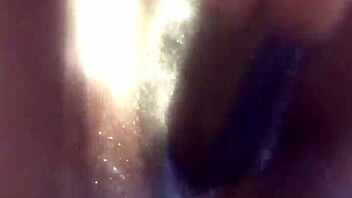 ebony babe in a water play scene with toys