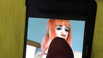 In a homemade setting, a petite latina brunette with big tits and a cute smile receives a cumtribute from a monster cock, leading to a cumshot for her new hot fan.