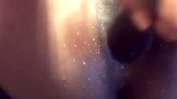 ebony babe in a water play scene with toys