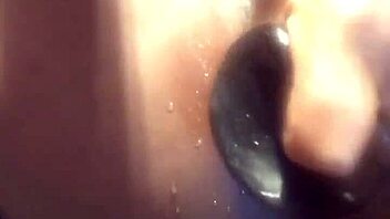 ebony babe in a water play scene with toys