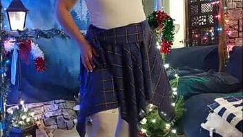 Steffi the hotwife dances in plaid skirt, teasing with her pussy moves.