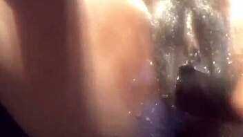 ebony babe in a water play scene with toys