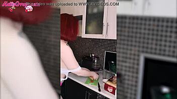 a sexy teen girl in cute lingerie fingers her pussy in the kitchen solo