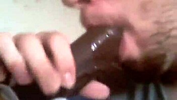 Bareback gay lover takes a huge black cock in his mouth
