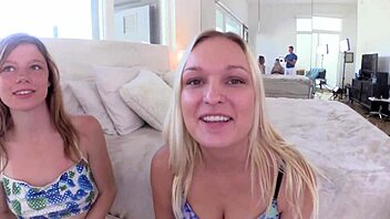 Mia and Victoria give a guy a blowjob together.