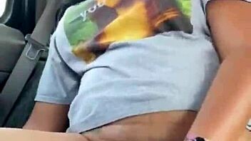 ebony woman fingers wet pussy in public car, teasing passersby with risky outdoor masturbation