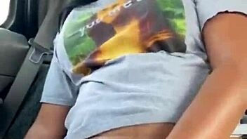 ebony woman fingers wet pussy in public car, teasing passersby with risky outdoor masturbation