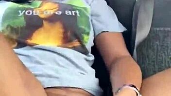 ebony woman fingers wet pussy in public car, teasing passersby with risky outdoor masturbation