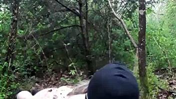 BDSM slave submits to drilling in outdoor scene