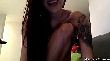 Amateur brunette with tattoos shows her pussy on webcam.