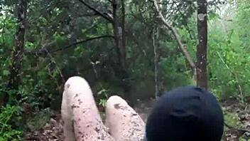 BDSM slave submits to drilling in outdoor scene