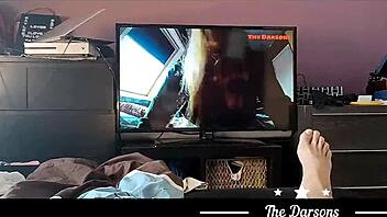 The Darsons' homemade video features a wife's handjob and a cumshot