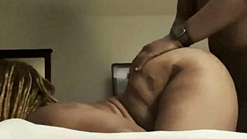 Ebony couple takes monster cock in ass doggystyle hard.