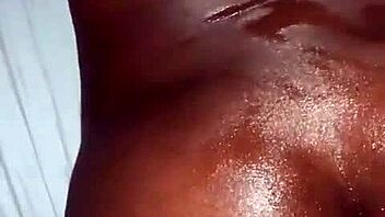 Oiled ebony beauty takes a hard cock. Her ass shakes with every deep thrust.