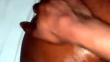 Oiled ebony beauty takes a hard cock. Her ass shakes with every deep thrust.