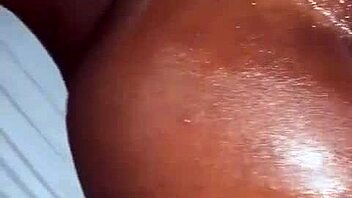 Oiled ebony beauty takes a hard cock. Her ass shakes with every deep thrust.