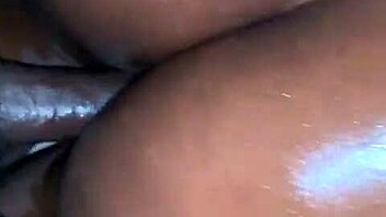 Oiled ebony beauty takes a hard cock. Her ass shakes with every deep thrust.
