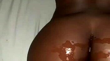 Oiled ebony beauty takes a hard cock. Her ass shakes with every deep thrust.