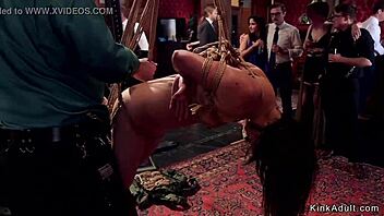 Busty MILF slave gagged and deepthroated in BDSM party