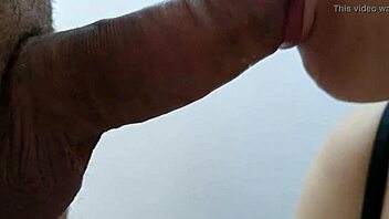 The wife eagerly sucks her husband's cock, swallowing his cumshot and nearly choking on it