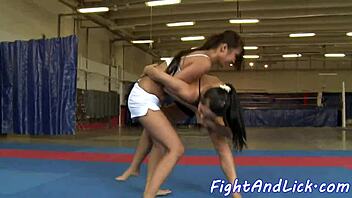 The asian dyke says, 'after that wrestling match, i'm licking your pussy now'