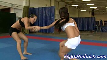 The asian dyke says, 'after that wrestling match, i'm licking your pussy now'