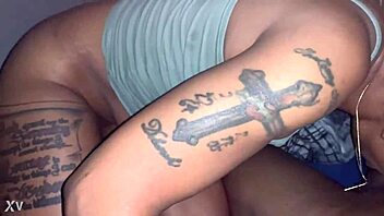 Black babe with big tits and tattoos sucks a big black dick