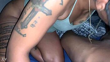 Black babe with big tits and tattoos sucks a big black dick