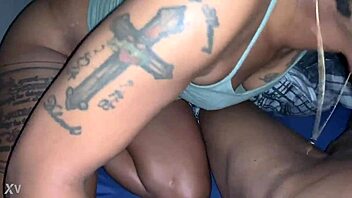 Black babe with big tits and tattoos sucks a big black dick
