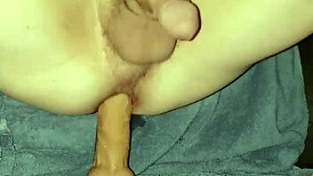 Gay man enjoys riding a dildo in close-up